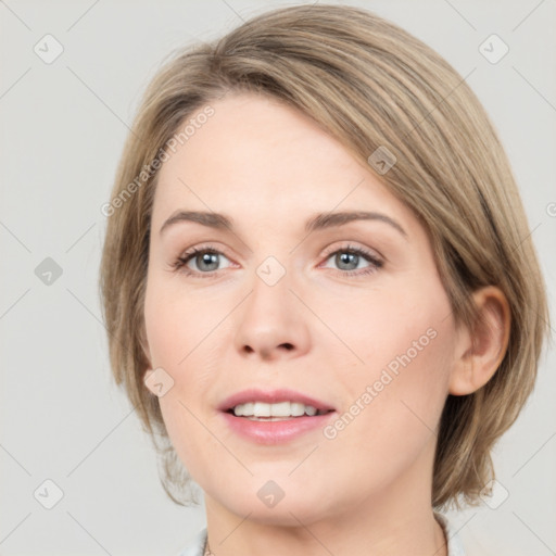 Joyful white young-adult female with medium  brown hair and green eyes