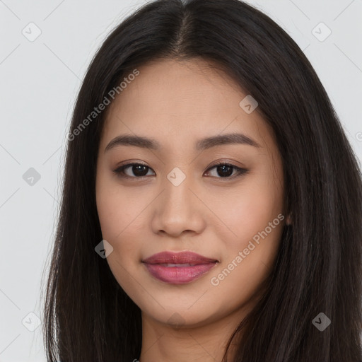 Joyful asian young-adult female with long  brown hair and brown eyes