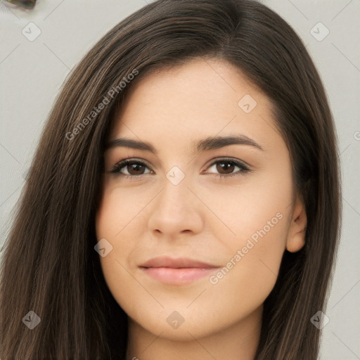 Joyful asian young-adult female with long  brown hair and brown eyes