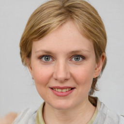 Joyful white young-adult female with medium  brown hair and blue eyes