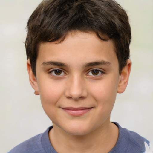 Joyful white child male with short  brown hair and brown eyes