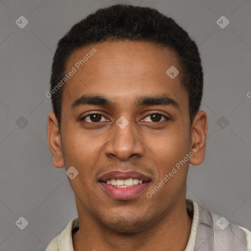 Joyful black young-adult male with short  brown hair and brown eyes