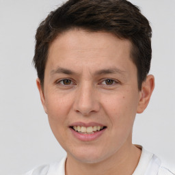 Joyful white adult male with short  brown hair and brown eyes