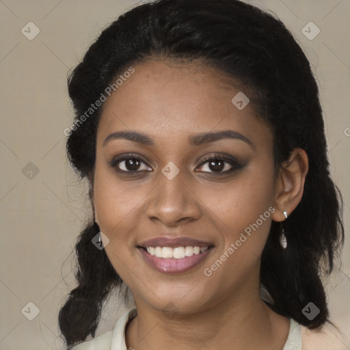 Joyful black young-adult female with medium  black hair and brown eyes