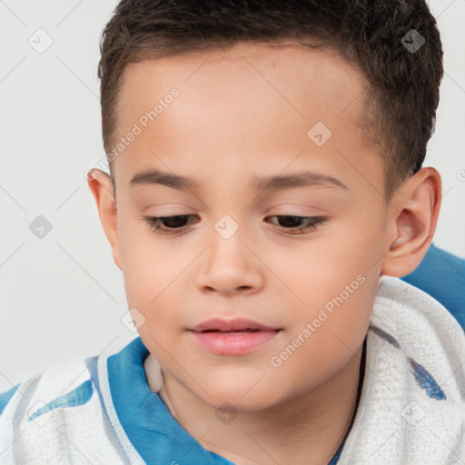 Joyful white child male with short  brown hair and brown eyes