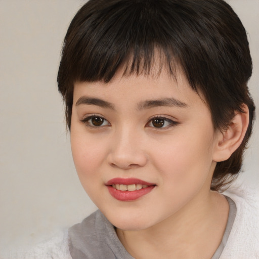 Joyful white child female with medium  brown hair and brown eyes