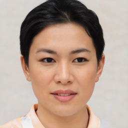 Joyful asian young-adult female with short  brown hair and brown eyes