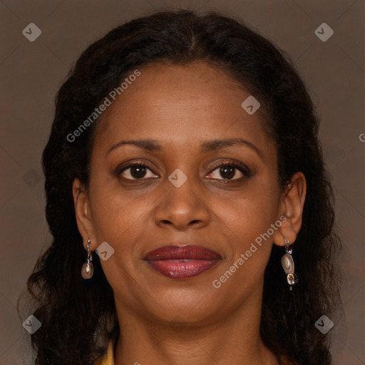 Joyful black young-adult female with long  brown hair and brown eyes