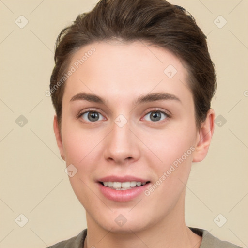 Joyful white young-adult female with short  brown hair and brown eyes