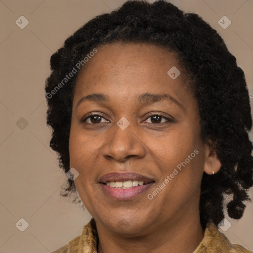 Joyful black adult female with medium  brown hair and brown eyes