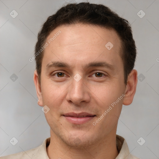 Joyful white adult male with short  brown hair and brown eyes