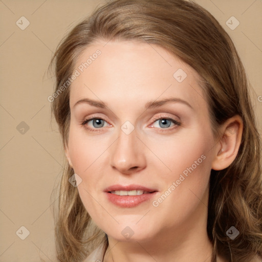 Joyful white young-adult female with long  brown hair and blue eyes