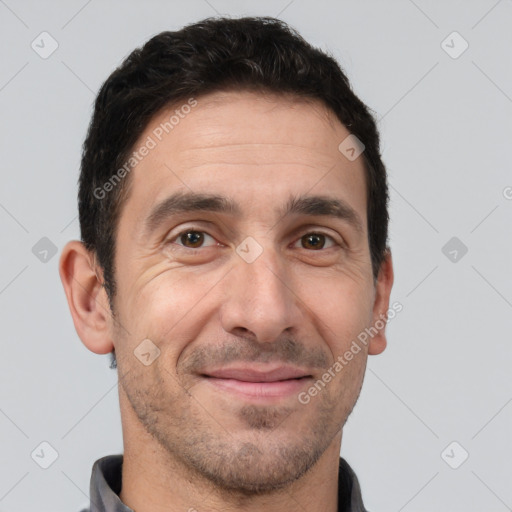 Joyful white adult male with short  brown hair and brown eyes