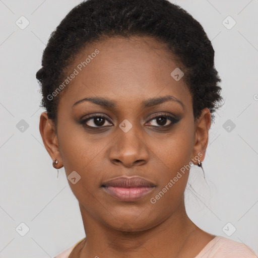 Joyful black young-adult female with short  brown hair and brown eyes