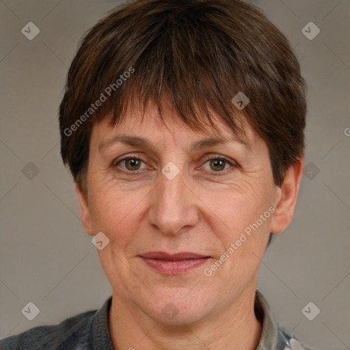 Joyful white adult female with short  brown hair and grey eyes