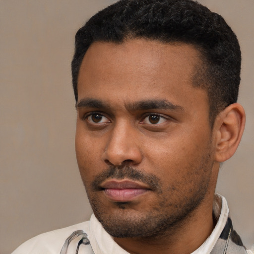 Neutral latino young-adult male with short  black hair and brown eyes