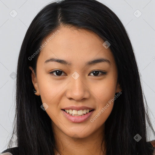 Joyful asian young-adult female with long  brown hair and brown eyes