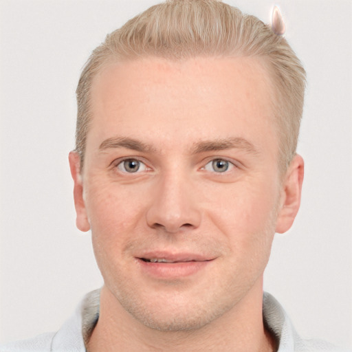 Joyful white adult male with short  brown hair and grey eyes