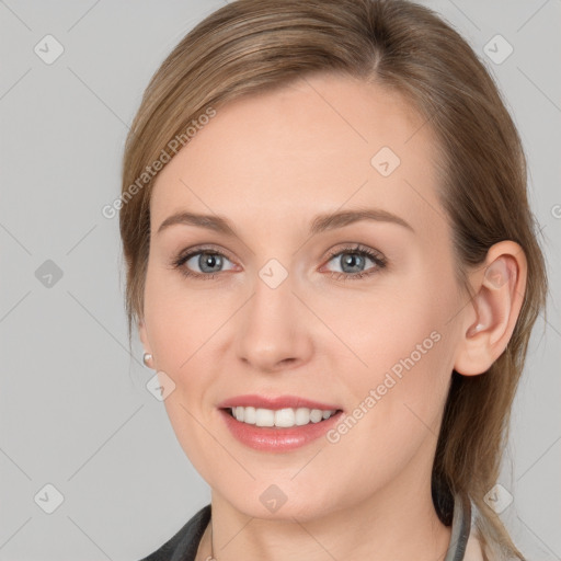 Joyful white young-adult female with medium  brown hair and grey eyes