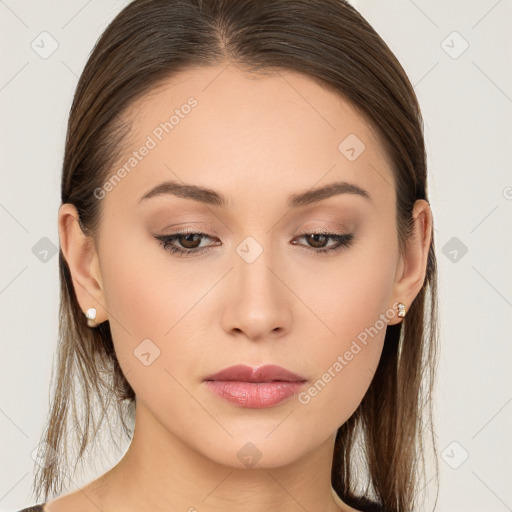 Neutral white young-adult female with long  brown hair and brown eyes
