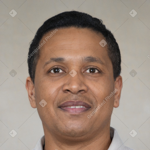 Joyful black adult male with short  black hair and brown eyes