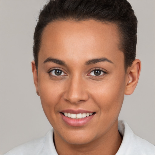 Joyful white young-adult female with short  brown hair and brown eyes