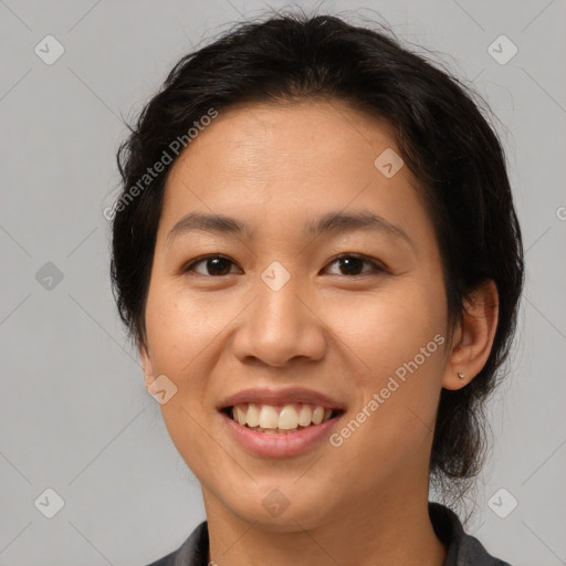 Joyful asian young-adult female with medium  brown hair and brown eyes