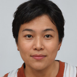 Joyful asian young-adult female with short  brown hair and brown eyes