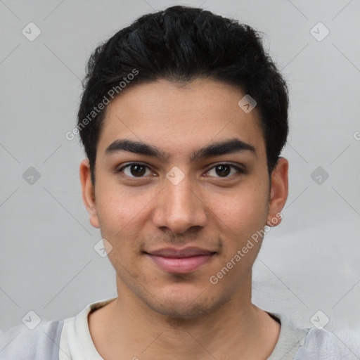 Joyful latino young-adult male with short  black hair and brown eyes