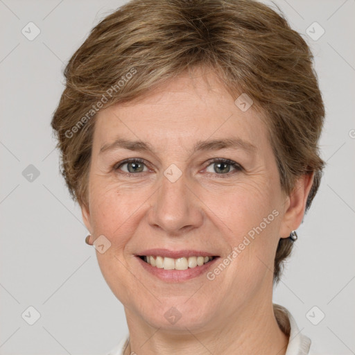 Joyful white adult female with short  brown hair and grey eyes