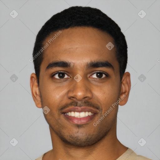 Joyful black young-adult male with short  black hair and brown eyes