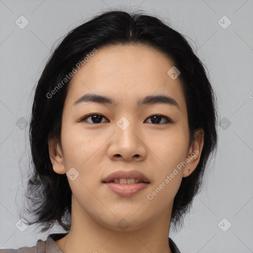 Joyful asian young-adult female with medium  black hair and brown eyes