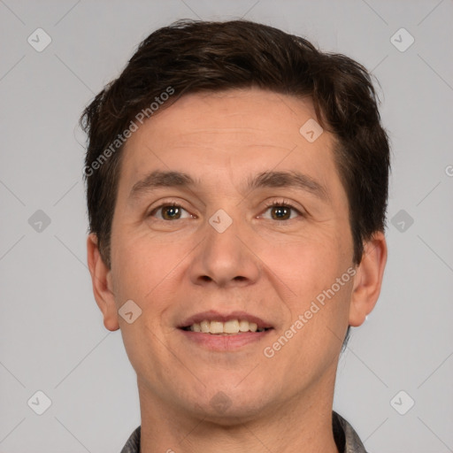 Joyful white adult male with short  brown hair and brown eyes