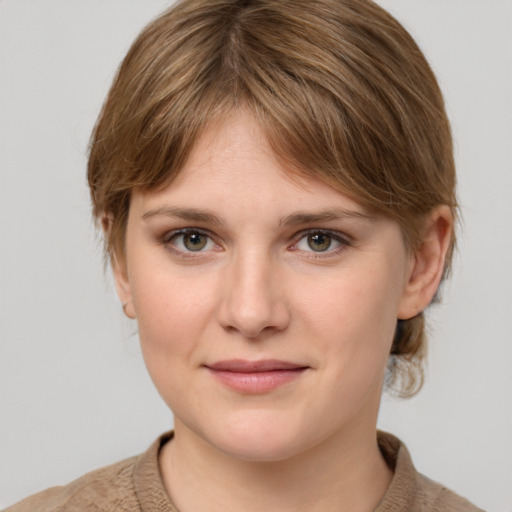 Joyful white young-adult female with medium  brown hair and grey eyes