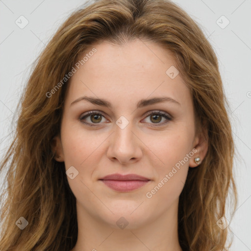 Joyful white young-adult female with long  brown hair and green eyes