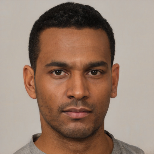 Neutral black young-adult male with short  black hair and brown eyes