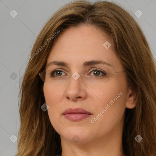 Joyful white adult female with long  brown hair and brown eyes