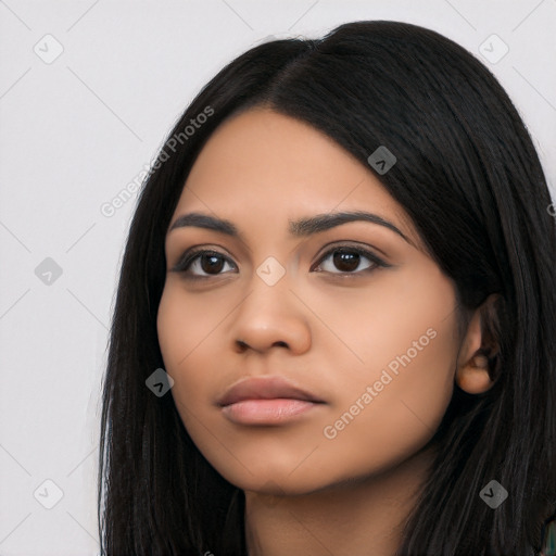 Neutral latino young-adult female with long  black hair and brown eyes