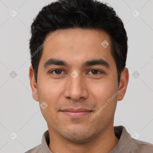 Joyful white young-adult male with short  black hair and brown eyes