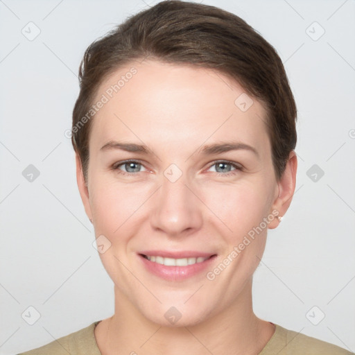 Joyful white young-adult female with short  brown hair and grey eyes