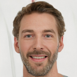 Joyful white adult male with short  brown hair and grey eyes