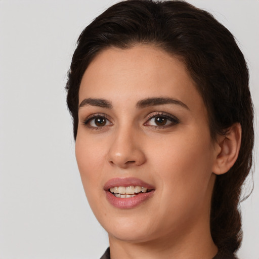 Joyful white young-adult female with medium  brown hair and brown eyes