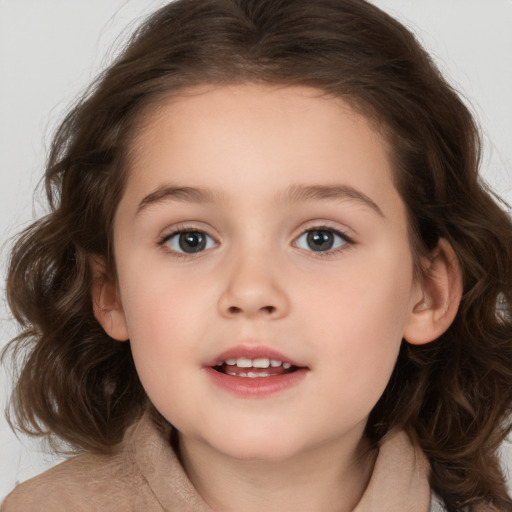 Joyful white child female with medium  brown hair and brown eyes