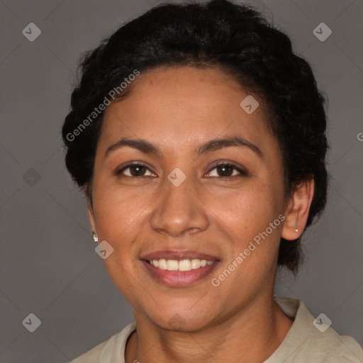 Joyful latino adult female with short  brown hair and brown eyes