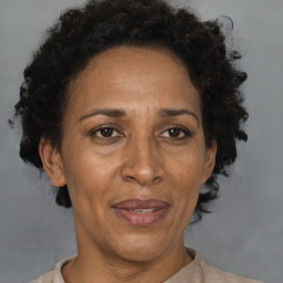 Joyful black adult female with short  brown hair and brown eyes