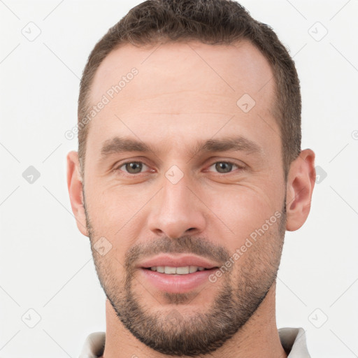 Joyful white young-adult male with short  brown hair and brown eyes