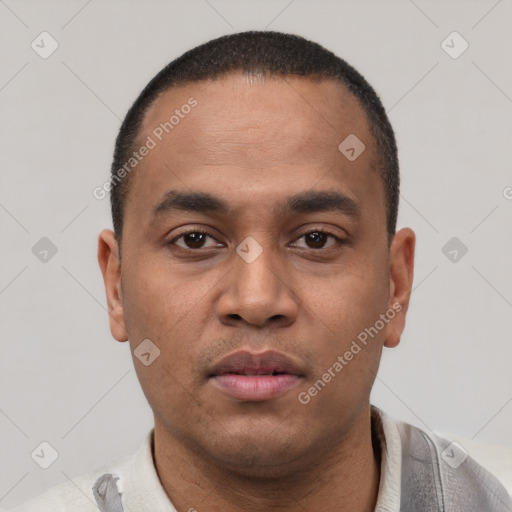 Neutral latino young-adult male with short  black hair and brown eyes