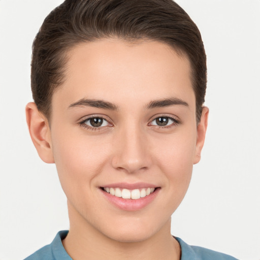 Joyful white young-adult female with short  brown hair and brown eyes