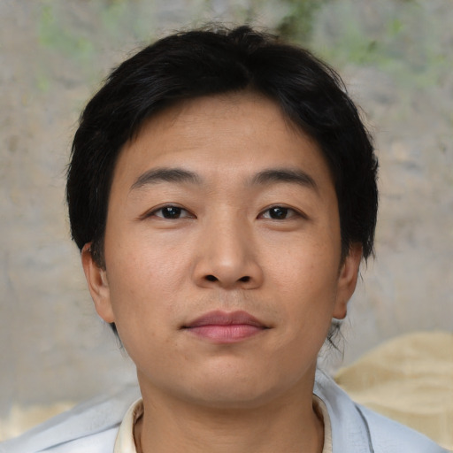 Neutral asian young-adult male with short  brown hair and brown eyes