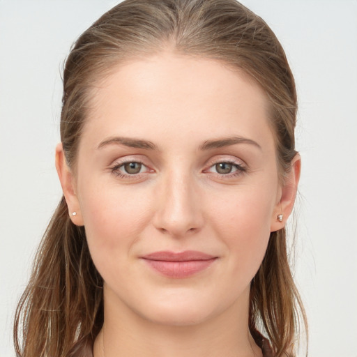 Joyful white young-adult female with long  brown hair and grey eyes